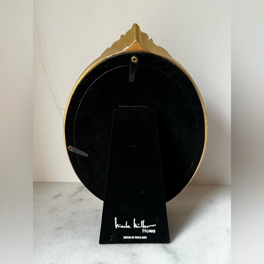 Nicole Miller elegant oval
